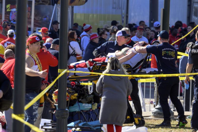 Police clear the area following a shooting at the Kansas City Chiefs NFL football Super Bowl celebration in Kansas City, Mo., Wednesday, Feb. 14, 2024.