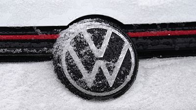 Snow glazes over the company logo on the grille of a 2024 Volkswagen GTI Saturday, Feb. 10, 2024, in Denver.