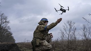 A Ukrainian serviceman of the 68 Oleksa Dovbush hunting brigade, launches a drone at the frontline near Vuhledar, Ukraine, Wednesday, Feb. 22, 2023. 