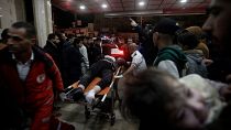 Palestinians wounded in Israeli airstrikes arrive at the Nasser hospital in the town of Khan Younis in the southern Gaza Strip.