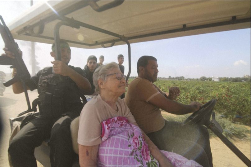 FILE - Hamas' militants transport Yaffa Adar, 85, an Israeli civilian kidnapped from Nir Oz, into Gaza strip in a golf cart, in an unspecified location between Israel and Gaza