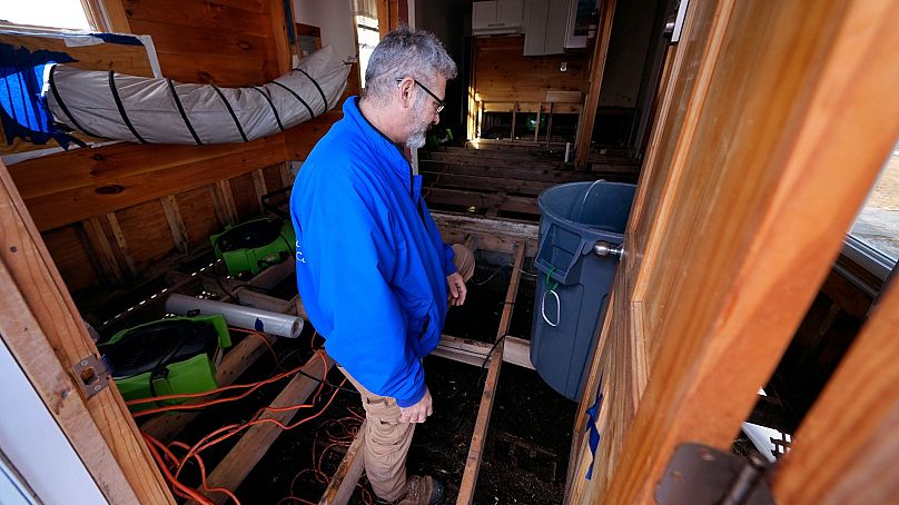 Haim Levy stands in his cottage near Hampton Beach, which was flood damaged during January 2024 storms, 9 February 2024, in Hampton, NH.