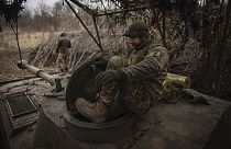 Ukrainian soldiers prepare a self-propelled artillery vehicle Gvozdika to fire towards the Russian positions on the frontline in the Donetsk region, Ukraine, Friday, Feb. 16, 