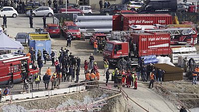 Rescue workers arrive at the scene of an accident at a construction site in Florence, Italy, Friday Feb. 16, 2024.
