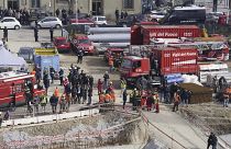 Rescue workers arrive at the scene of an accident at a construction site in Florence, Italy, Friday Feb. 16, 2024.
