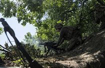 A Ukrainian marine of 35th brigade fires by automatic grenade launcher AGS-17 towards Russian positions on the outskirts of Avdiivka, Ukraine, on June 19, 2023.