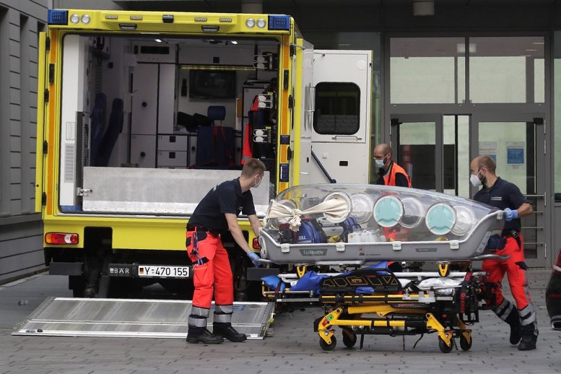 An empty stretcher is carried back into an ambulance which is believed to have transported Alexei Navalny at the entrance of the Charite hospital in Berlin, August 2020