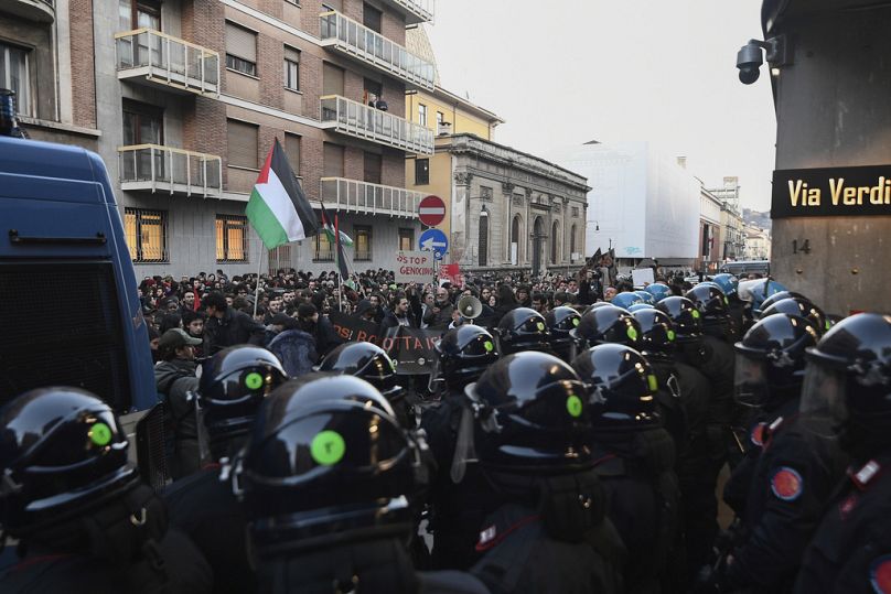 Pro-Palestinian protesters demonstrate by Rai headquarters in Turin, Italy, Tuesday, Feb. 13, 2024.