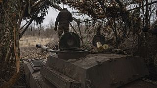 Ukrainian soldiers prepare a self-propelled artillery vehicle Gvozdika to fire towards the Russian positions on the frontline in the Donetsk region, Ukraine, Feb. 16, 2024.