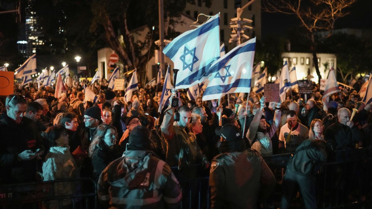 Demonstrators protest against Israeli Prime Minister Benjamin Netanyahu and call for new elections in the latest weekly protest against his handling of the Israel-Hamas war.