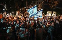 Demonstrators protest against Israeli Prime Minister Benjamin Netanyahu and call for new elections in the latest weekly protest against his handling of the Israel-Hamas war.