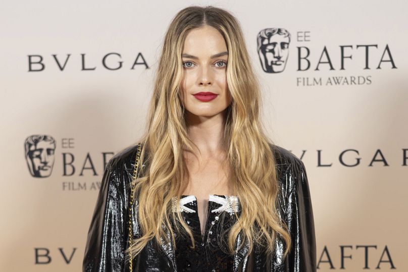 Margot Robbie poses for photographers upon arrival for the BAFTA Nominees Party in London, 17 February 2024