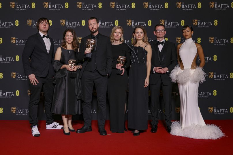 Crew of '20 Days in Mariupol' pose for photographers at the 77th British Academy Film Awards, BAFTA's, in London.