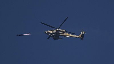 FILE - Israeli attack helicopter fires a missile into the Gaza Strip, Monday, Dec. 18, 2023.