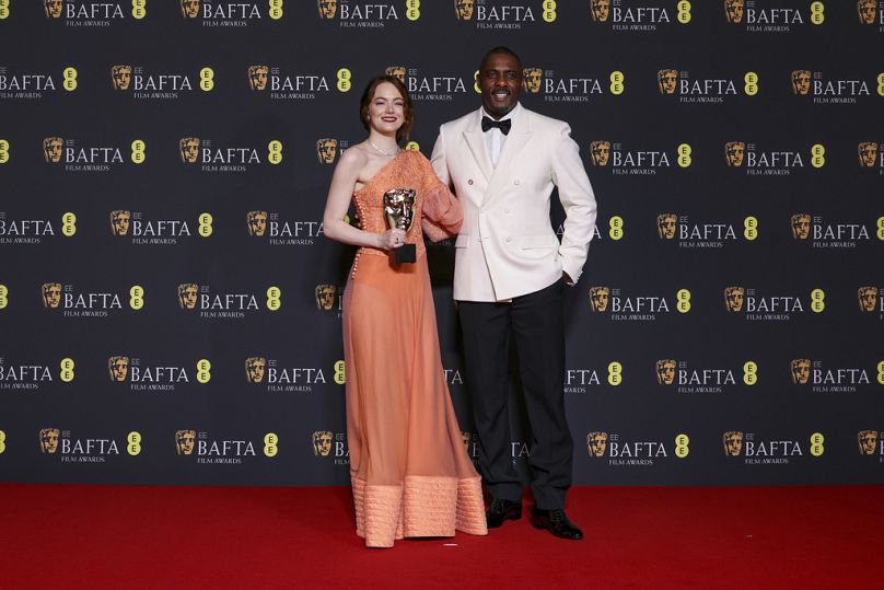 Emma Stone and Idris Elba pose for photographers at the 77th British Academy Film Awards, BAFTA's, in London