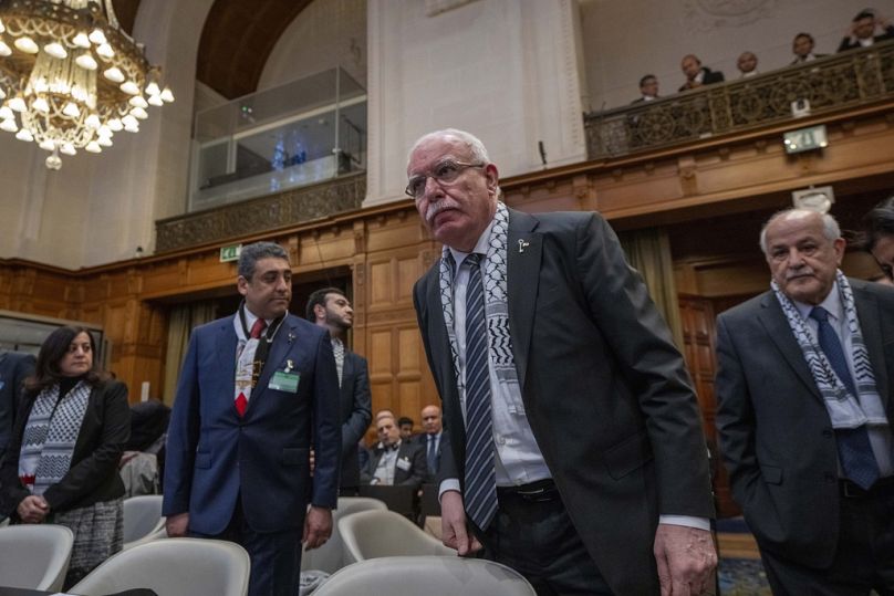 Riyad Al-Maliki, minister of Foreign Affairs of the Palestinian National Authority, center, and Riyad Mansour, representative of the Palestinian National Authority at the U.N.