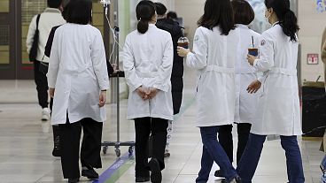Medical workers walk inside a general hospital in Gwangju, South Korea.