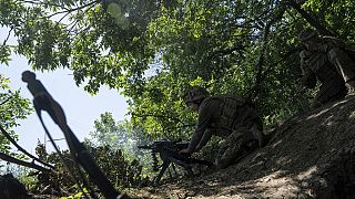  A Ukrainian marine of 35th brigade fires by automatic grenade launcher AGS-17 towards Russian positions on the outskirts of Avdiivka, Ukraine, on June 19, 2023.