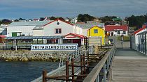 In this March 8, 2012 photo, a sign welcomes people at the port where cruise ships arrive in Stanley, Falkland Islands. 