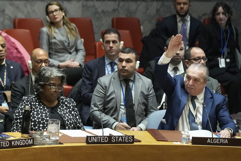 Algerian Ambassador to the United Nations Amar Bendjama votes to approve a resolution concerning a ceasefire in Gaza while US Ambassador Linda Thomas-Greenfield looks on.