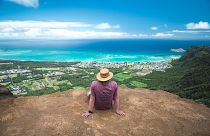 A tourist takes in the natural beauty of the Kuli'ou'ou Ridge Trail in Honolulu