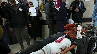 Palestinians wounded in the Israeli bombardment of the Gaza Strip are brought to a hospital in Deir al Balah, Gaza Strip, on Saturday, Feb. 17, 2024. 