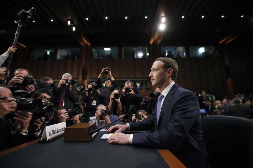 Facebook CEO Mark Zuckerberg takes his seat to testify before a joint hearing of the Commerce and Judiciary Committees on Capitol Hill in Washington, April 2018