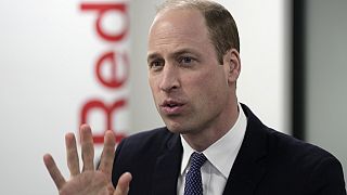 Britain's Prince William, The Prince of Wales, gestures as he visits the British Red Cross at its headquarters in London, Tuesday, Feb. 20, 2024.