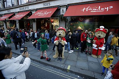The resident bears of the Hamleys toy store stand in front of their newly unveiled Christmas window displays on Regent Street in London, Friday, Nov. 2, 2018