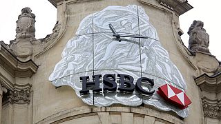 The logo of British bank HSBC is visible on the facade of HSBC France headquarters on the Champs Elysees in Paris, Monday Feb. 9, 2015.