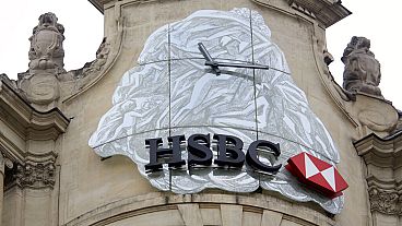 The logo of British bank HSBC is visible on the facade of HSBC France headquarters on the Champs Elysees in Paris, Monday Feb. 9, 2015.