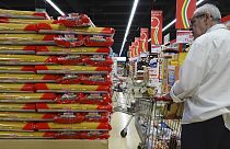 Customers look at packages of pasta on sale in a supermarket in Milan, northern Italy, Thursday, June 8, 2023.