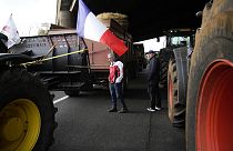 Farmers walk on a blocked highway, Wednesday, 31 January, 2024 in Chilly-Mazarin, south of Paris. 