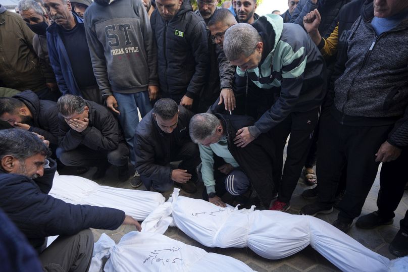 Palestinians mourn over relatives killed in the Israeli bombardments of the Gaza Strip at Al Aqsa Hospital in Deir al Balah, Gaza Strip, on Thursday, Feb. 22, 2024.