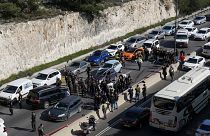 Les forces de sécurité israéliennes examinent la scène après l'attaque survenue près de la colonie de Maale Adumim en Cisjordanie, jeudi 22 février 2024.
