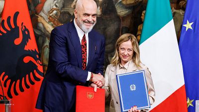 Italy's Prime Minister Giorgia Meloni her Albanian counterpart Edi Rama shake hands after signing a memorandum of understanding on migrant management centres.