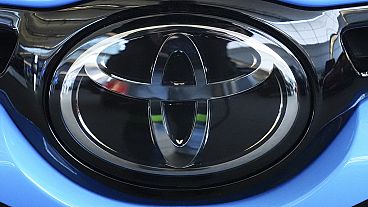 This is the Toyota logo on a Toyota GR Corolla on display at the Pittsburgh International Auto Show in Pittsburgh, Feb. 15, 2024. (AP Photo/Gene J. Puskar)