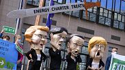 Protesters outside the EU Council headquarters in Brussels in 2021 demand withdrawal from the Energy Charter Treaty. Some now sense victory is in sight.