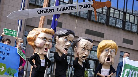 Protesters outside the EU Council headquarters in Brussels in 2021 demand withdrawal from the Energy Charter Treaty. Some now sense victory is in sight.