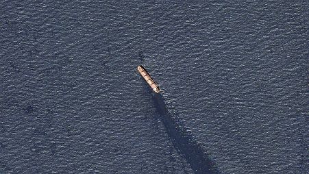 The Belize-flagged bulk carrier Rubymar is seen in the southern Red Sea near the Bay el-Mandeb Strait leaking oil after an attack by Yemen's Houthi rebels, Feb. 20, 2024.