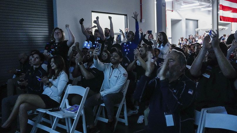 Intuitive Machines employees cheer during a watch party moments after they became the first commercial company to softly land on the moon on Feb. 22, 2024, in Houston
