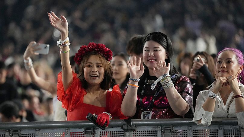 Fans attend a concert by Taylor Swift as part of the "Eras Tour" at the Tokyo Dome, Wednesday, Feb. 7, 2024, in Tokyo.