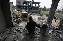  Palestinians search for survivors after an Israeli airstrike on a residential building of the Yaghi family in Deir al Balah, Gaza Strip