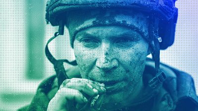 A Ukrainian serviceman who recently returned from the trenches of Bakhmut smokes a cigarette in Chasiv Yar, March 2023