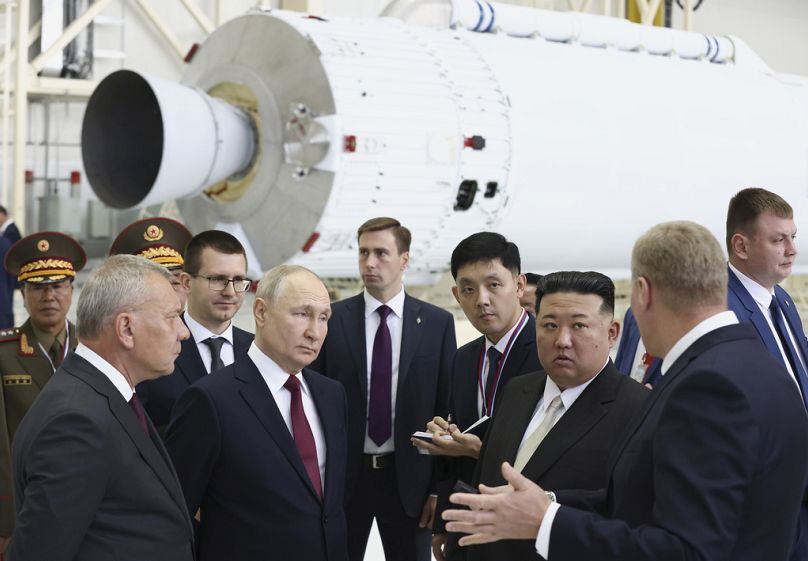 Russian President Vladimir Putin and North Korea's leader Kim Jong Un examine a rocket assembly hangar during their meeting at the Vostochny cosmodrome, September 2023