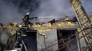 Firefighters work on the site of a burning building after a Russian attack in Odesa, Ukraine, Feb. 23, 2024. 