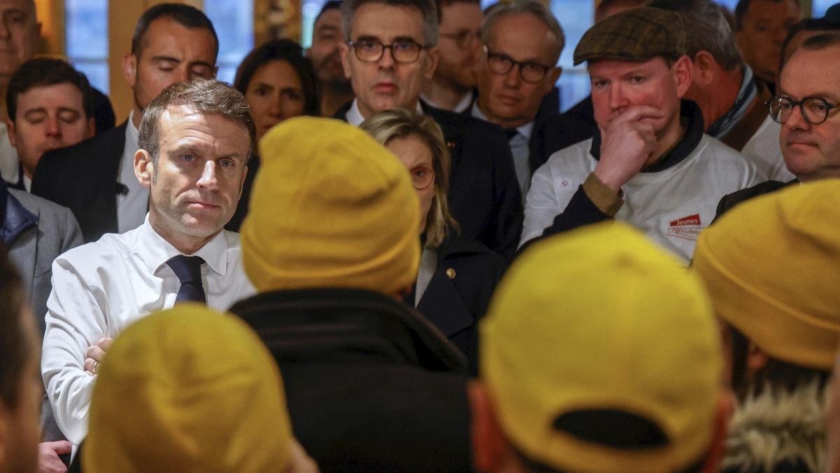 Angry french farmers greet President Emmanuel Macron at major fair