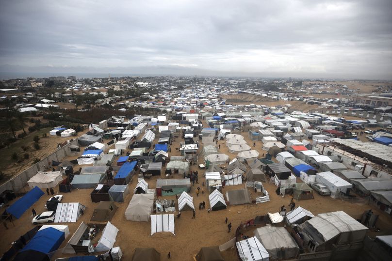 A view of a makeshift tent camp for Palestinians displaced by the Israeli ground offensive on the Gaza Strip, in Rafah, Gaza Strip, Sunday, Feb. 18, 2024