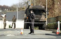 Police and bomb disposal experts stand at the scene near St Michael Avenue following the discovery of a suspected WWII explosive device, in Plymouth, England, Feb. 23, 2024.