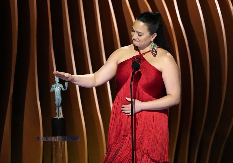 Lily Gladstone accepts the award for outstanding performance by a female actor in a leading role for "Killers of the Flower Moon" at the 30th annual SAG Awards in Los Angeles.